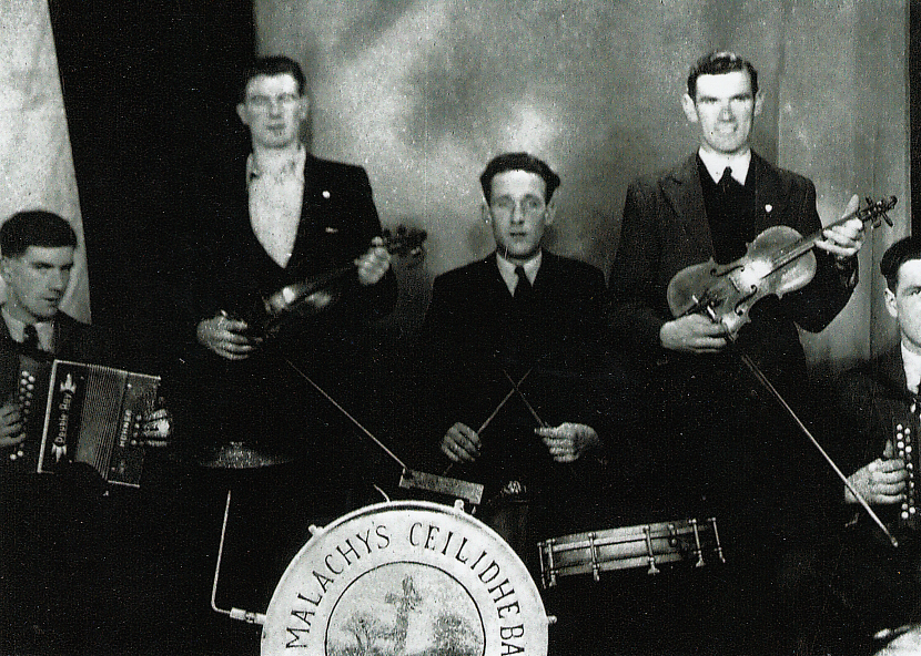 Moortown Ceili Band. This picture was taken on Sunday 18th January 1948, all five members were Lough Neagh fishermen. 
From left to right: Richard’s uncle Otto Crozier holding the accordian, Arthur Ryan, Tommy John Conlon, Richard's uncle George Crozier holding the fiddle, and Hughie Conlon. George Crozier is the George that Owenie mentioned in this episode.