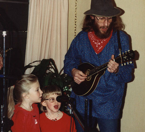 Erin and Amber singing with their father at a nursing home circa 1992 