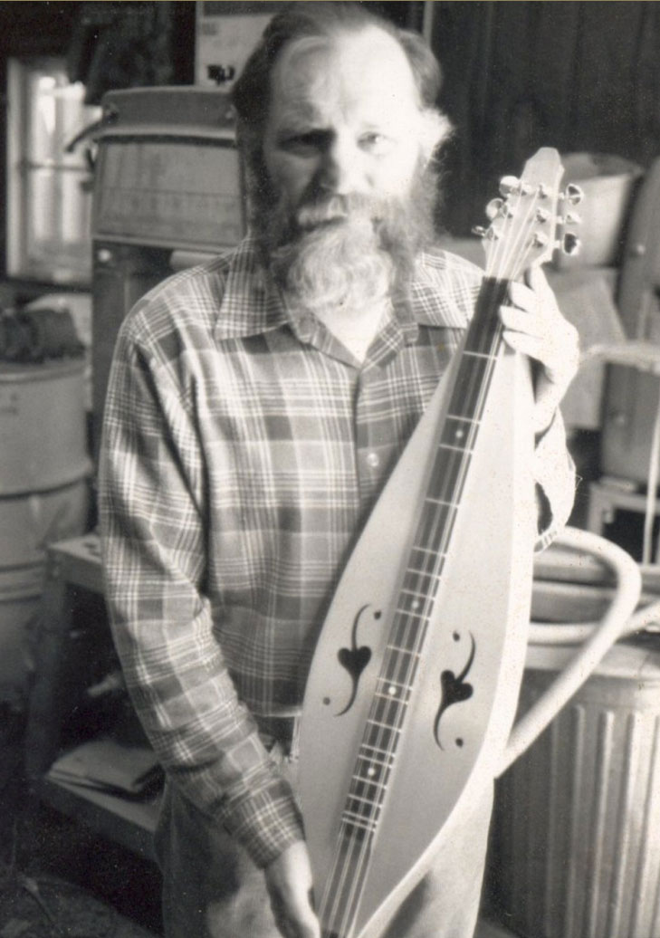 Howard Rugg, mid-1980s with a Folk Roots custom teardrop 6 string. 