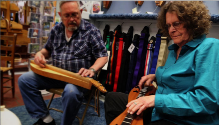 Jim Woods and Judy playing in the McSpadden Dulcimer Shoppe in 2013.