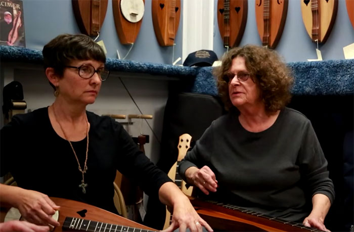 Mary Giger and Judy playing in the McSpadden Dulcimer Shoppe in 2013.