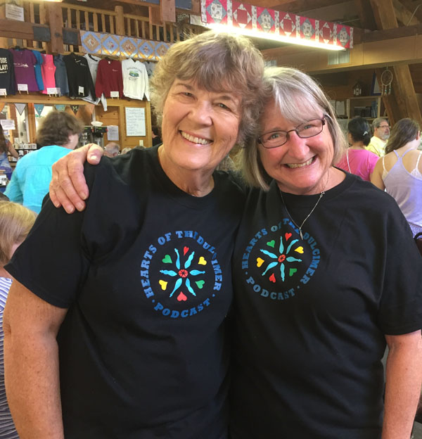Two women from The Three Rivers Dulcimer Society sporting the Hearts of the Dulcimer tshirt. 
