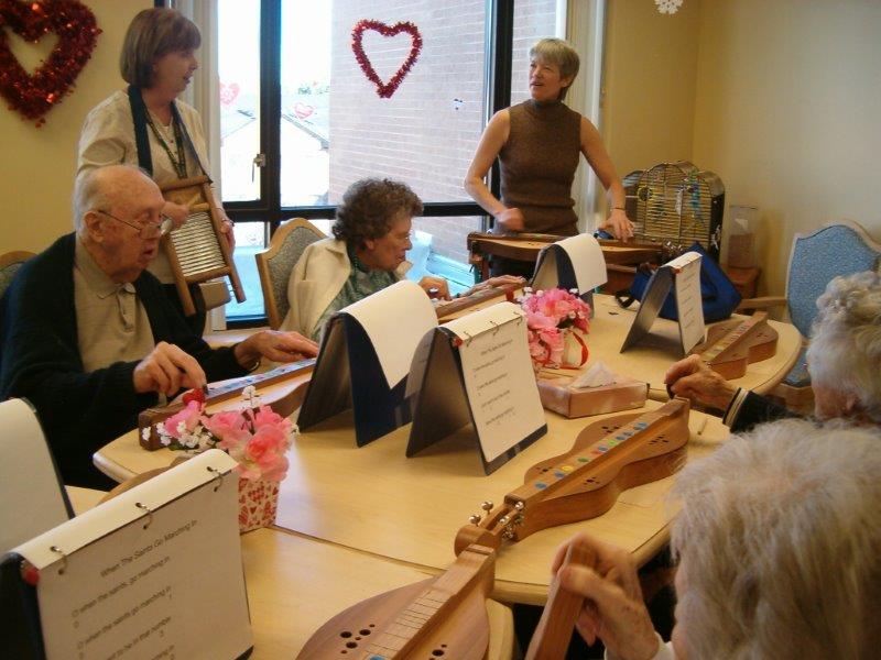 Nazareth Homes in Louisville, KY, artist-in-resident, patients playing dulcimer with adapted song material 
