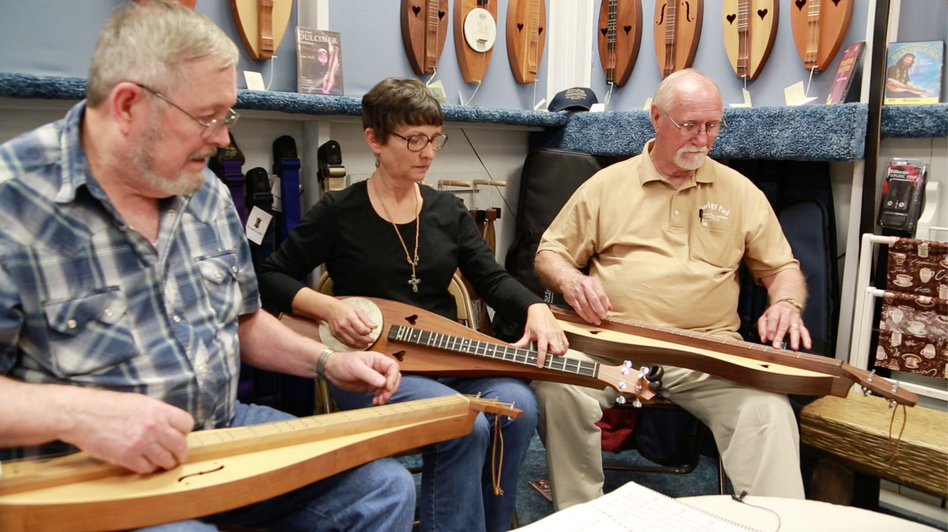 Jim, Mary, and Jack playing Southwind in the Dulcimer Shoppe gazebo (2013.) 