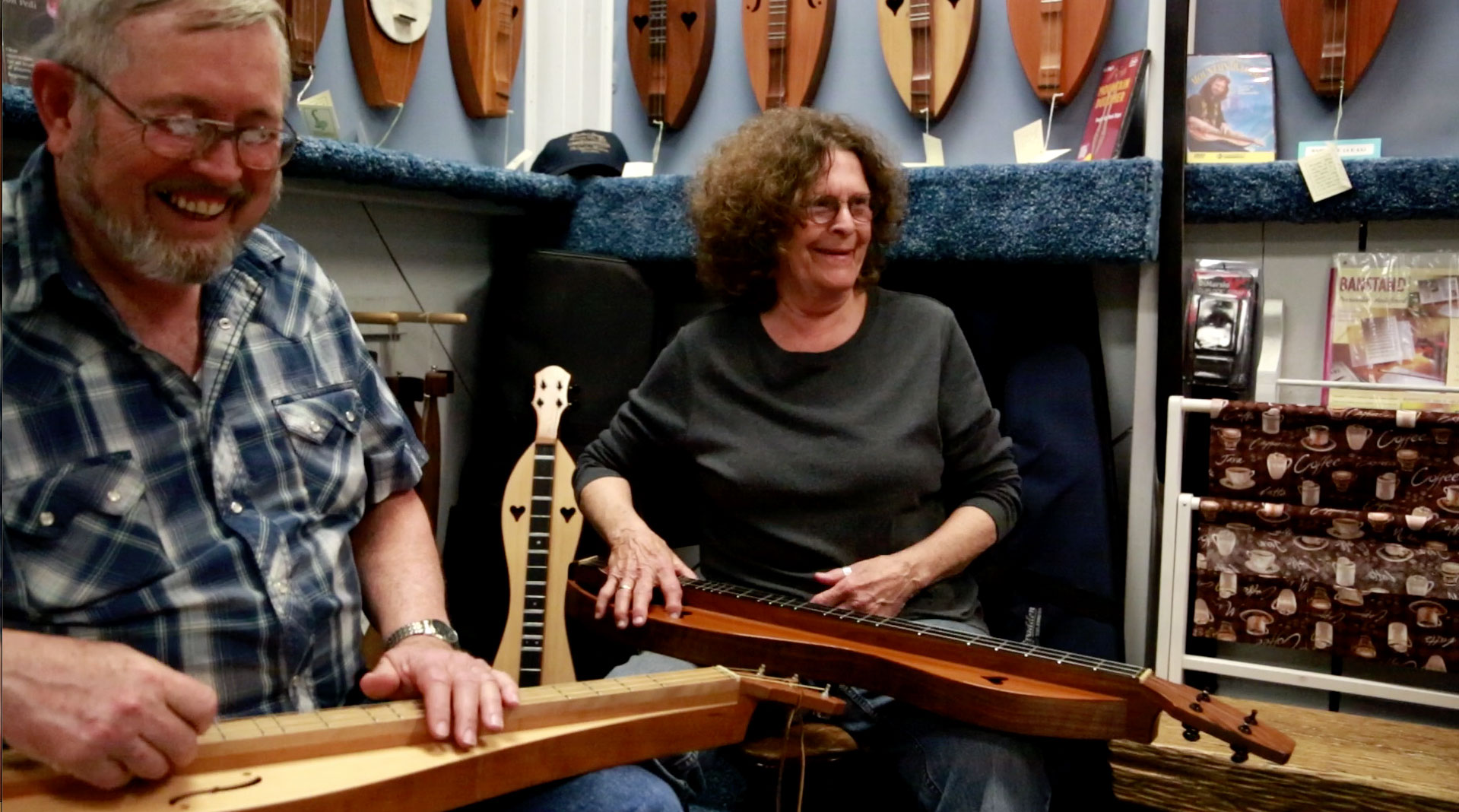 Jim and Judy about to play Dodd Mountain Waltz in the Dulcimer Shoppe gazebo (2013). 
